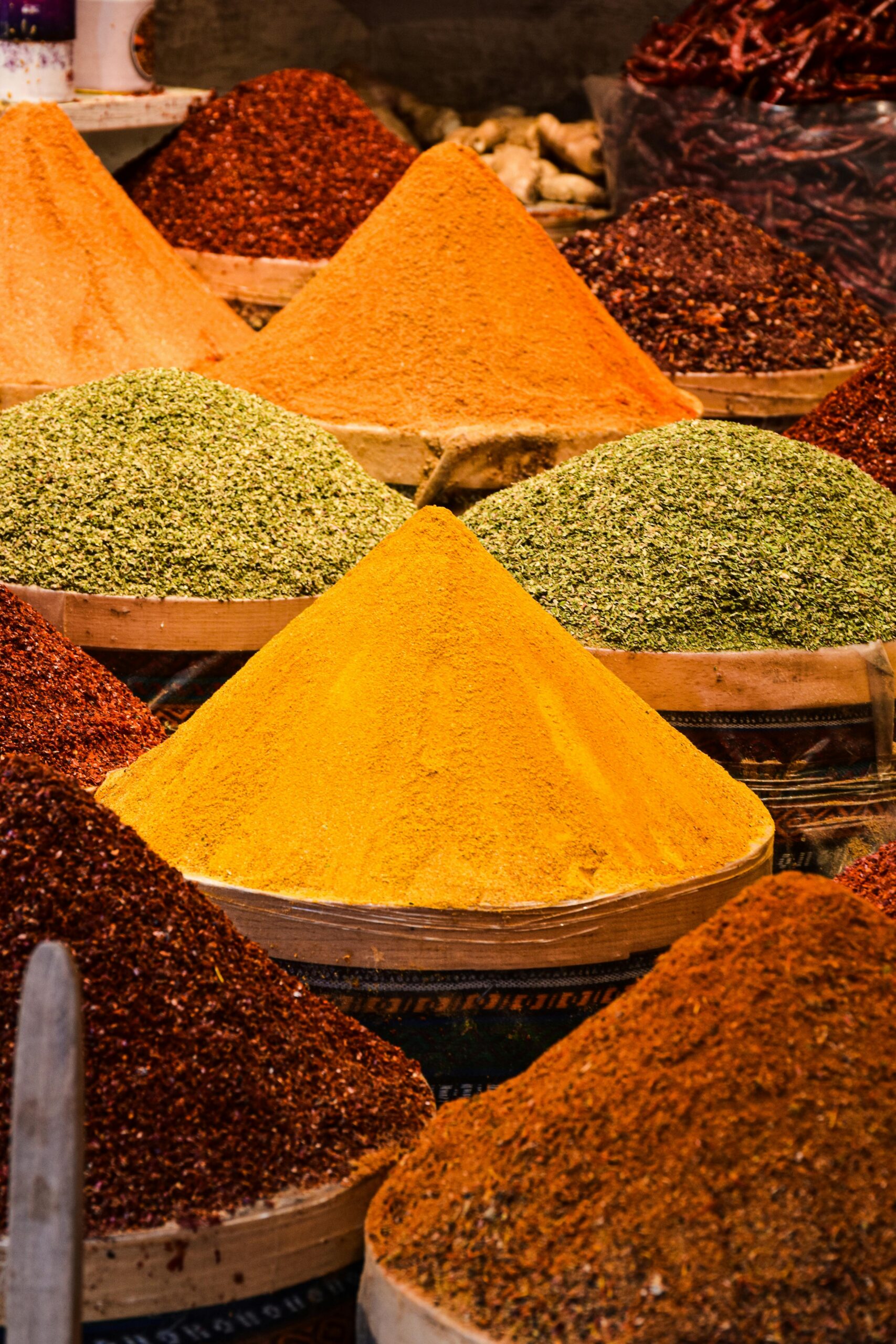 A colorful array of spices displayed in a traditional Istanbul market, showcasing rich flavors and textures.